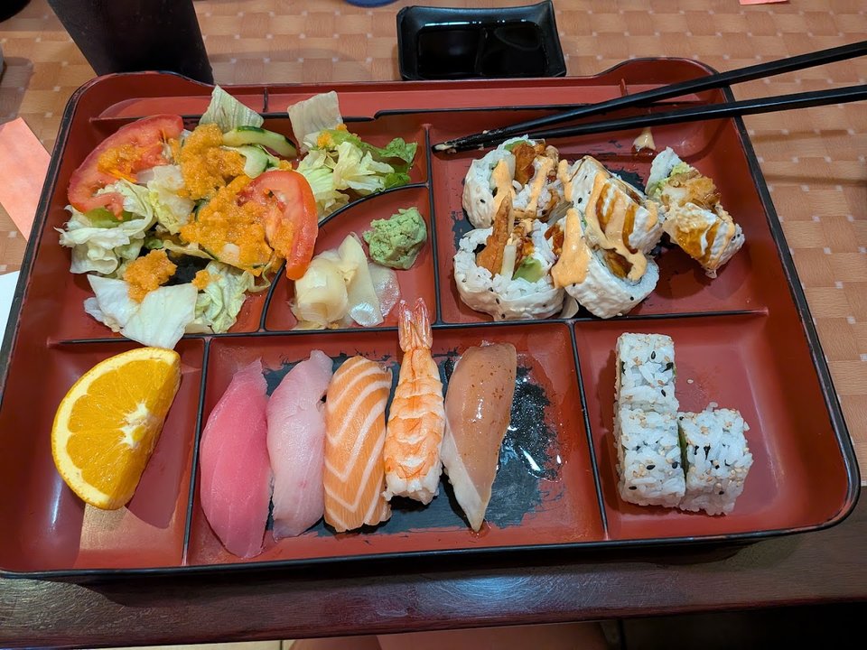 Sushi rolls arranged on a restaurant plate.