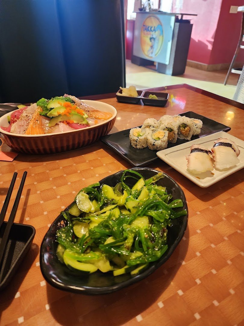Japanese appetizers and salads on a table.