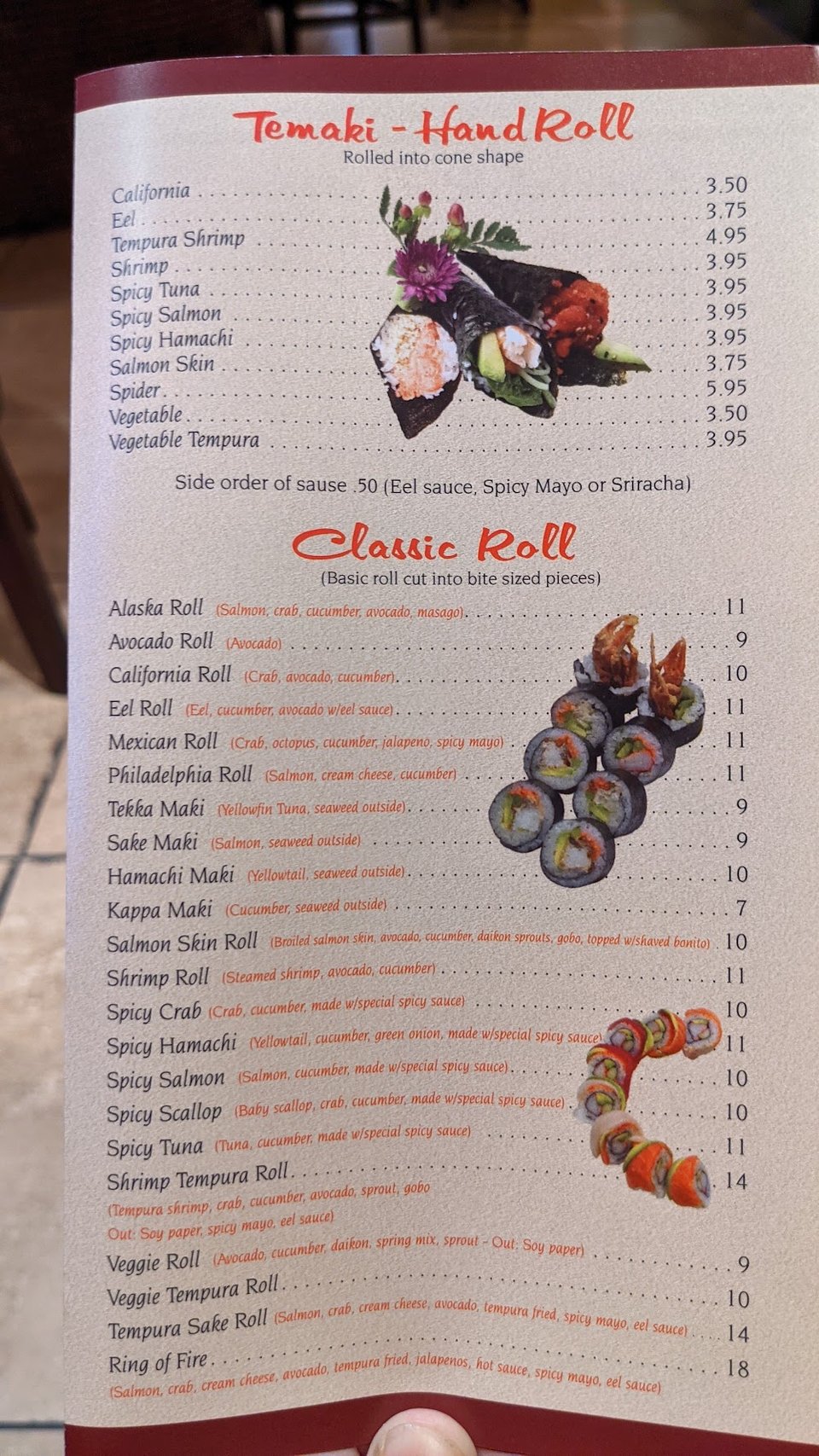 Sushi menu listing rolls, nigiri, and sashimi.